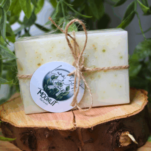 Luna Zest natural handmade soap bar with dried lime leaf, shea butter, and citrus essential oils, crafted by Moonlit Naturals.